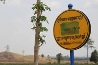 a sign in Cambodia promoting bed nets to prevent malaria